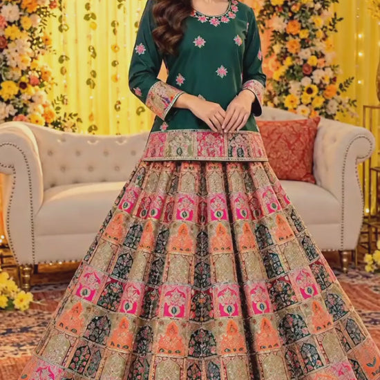 Video of emerald green embroidered short shirt with multicolor lehenga by Ruhaan Fabric